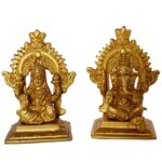Laxmi And Ganesha Sitting On A Carving Throne
